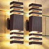 A pair of modern black LED wall sconces with vertical light strips mounted on a textured wall.
