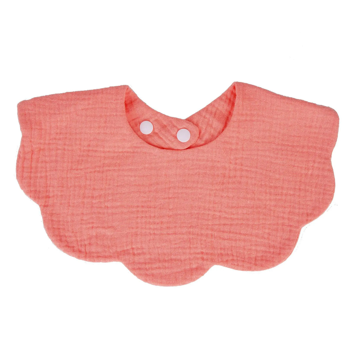 A soft coral pink baby bib in a bandana style with a rounded shape and a small button closure.