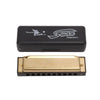 A black harmonica case and a brass harmonica in the C key.