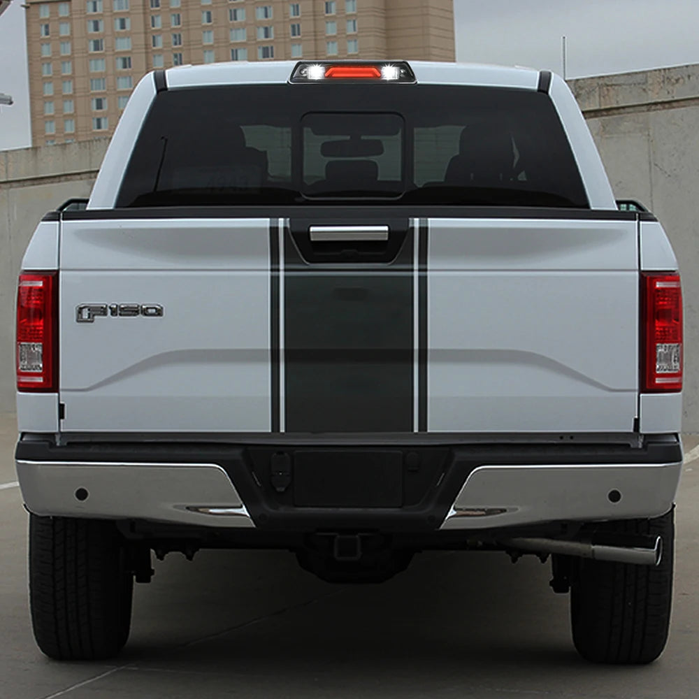 Rear view of a white Ford F-150 pickup truck with a smoked LED third brake light.