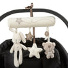 A soft plush bunny rattle toy with a star decoration hanging from a black strap.