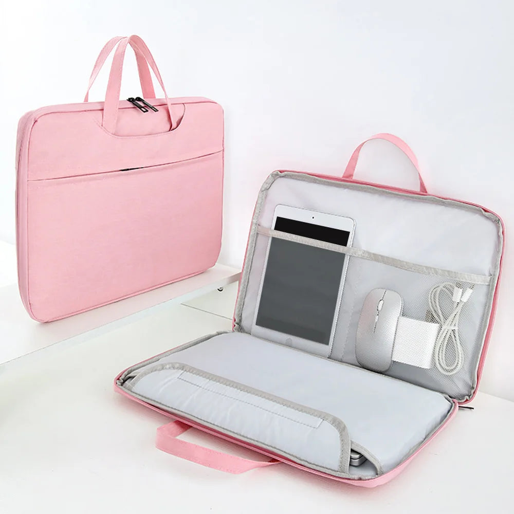 A pink universal laptop sleeve case for 11-16 inch notebooks, shown open with a laptop and mouse inside.