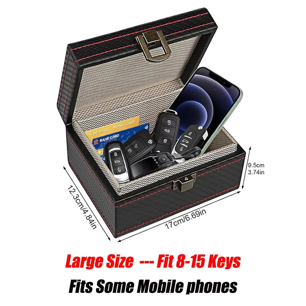 A black carbon fiber box with a lid open, designed to store 8-15 keys and mobile phones.