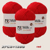Three skeins of red silk-friendly milk cot yarn for knitting and crochet projects.