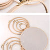 A bamboo embroidery hoop with an adjustable screw mechanism and a circular wooden board.