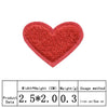 A red heart shaped iron-on patch with a textured surface.