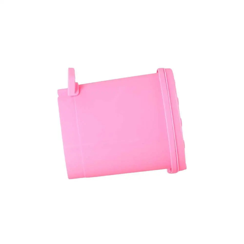 A pink mini strawberry trash can with a pop-up lid.