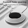 A close-up view of a silicone faucet draining mat with a raised edge, showing custom hole spacing for a faucet.
