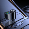 A close-up view of a black car charger with a digital display and USB-C port resting on a metallic surface.