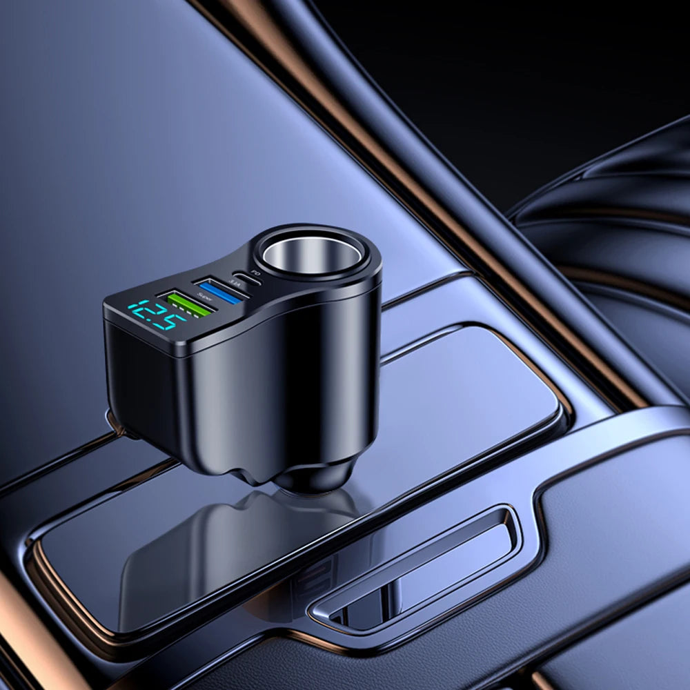 A close-up view of a black car charger with a digital display and USB-C port resting on a metallic surface.
