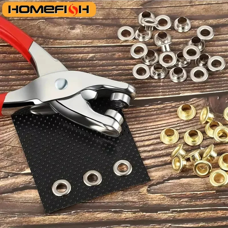 A silver pliers is shown next to a black plate with multiple metal eyelets and a pile of similar eyelets.