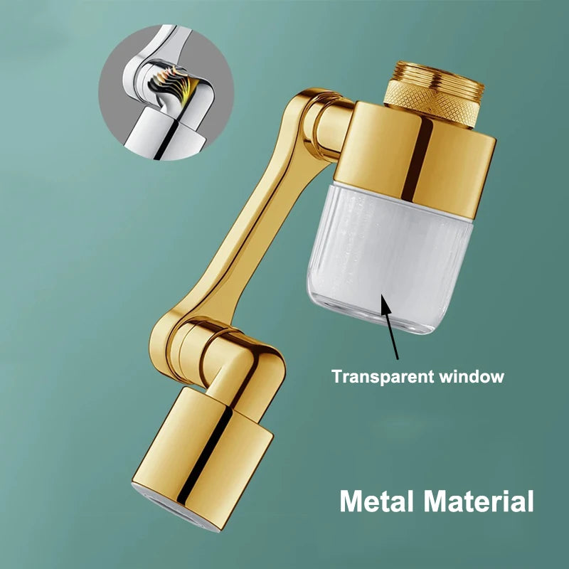 A gold metal faucet extender with a transparent window and spray head, shown against a muted green background.
