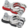 A pair of quick-release copper car battery terminals, one red and one black.