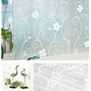 Glass stickers featuring a white floral swirl pattern for privacy windows