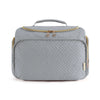 A gray quilted travel toiletry bag with a handle and gold-toned zipper details.