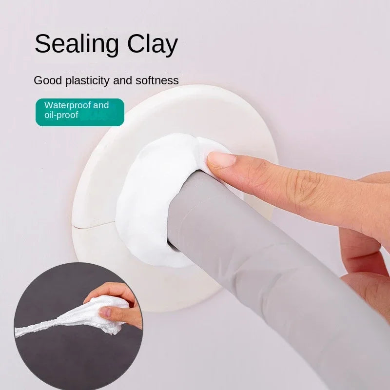 A hand is applying white sealing clay to an AC hole or pipe gap using a tool.