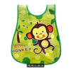 A bright green silicone bib featuring a cartoon monkey design for weaning toddlers.