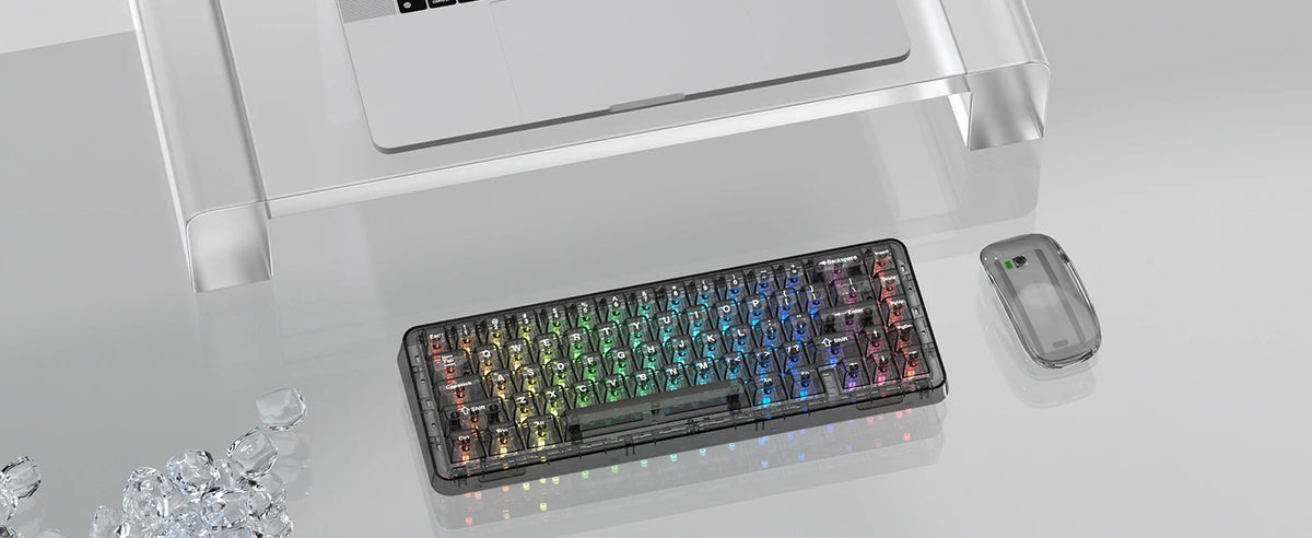 A close-up view of a black mechanical keyboard with crystal clear RGB backlit keycaps and a separate keycap shown next to it.