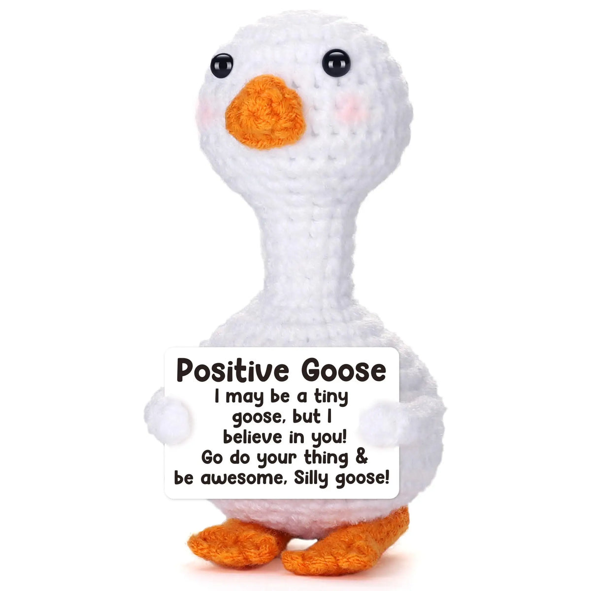 A white crochet goose figurine with an orange beak and a card that says Positive Goose
