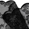 Gros plan de rideaux en dentelle florale noire avec des motifs complexes.