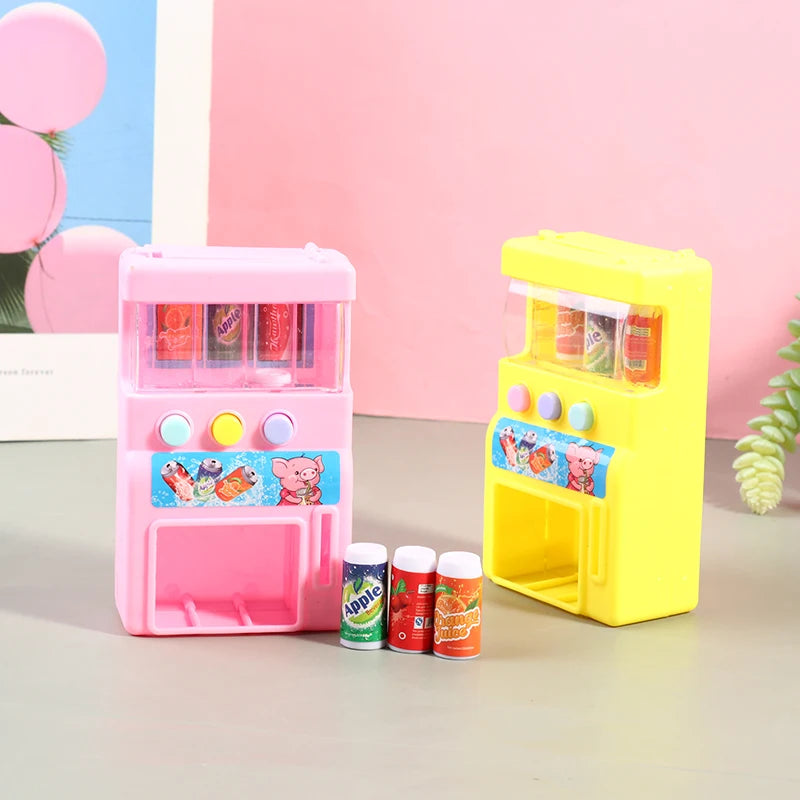 Pink and yellow interactive vending machine toy with play coins and colorful drinks
