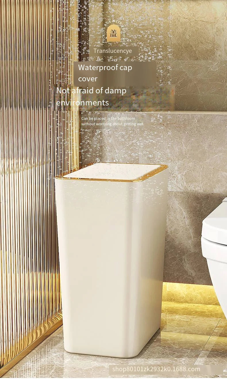 A white pop-up slim trash can with a translucent cover is shown next to a toilet.