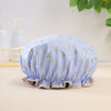 Light blue reusable elastic shower cap with gold heart pattern