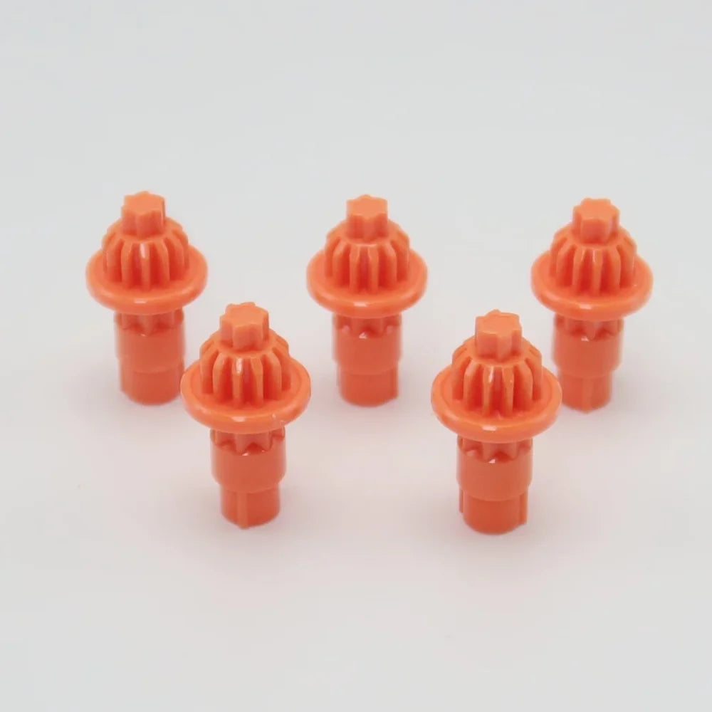 A set of five orange replacement drivers for a battling top, packaged together.