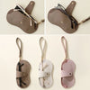 A set of three retro lychee pattern PU leather glasses cases in beige and pink shades.