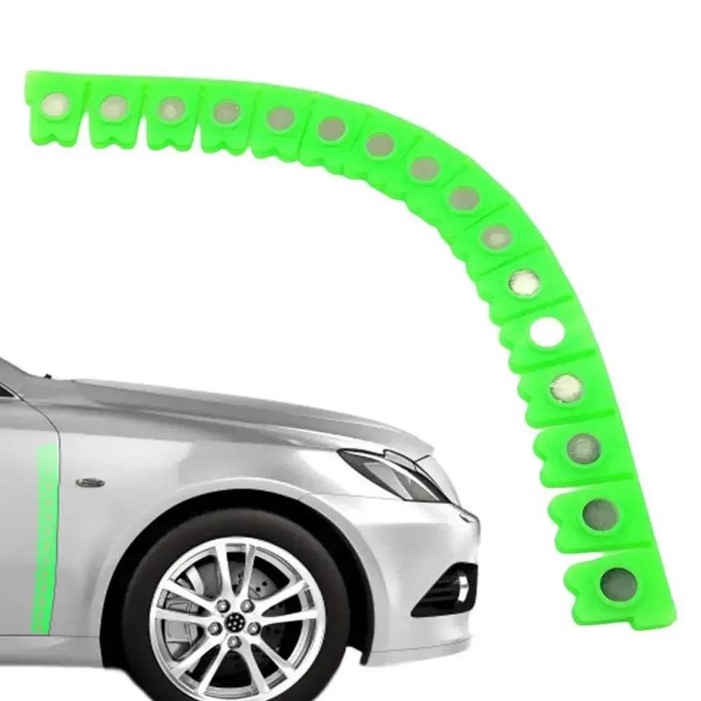 A bright lime green magnetic dry grinding protective strip is shown curved over a silver car body.