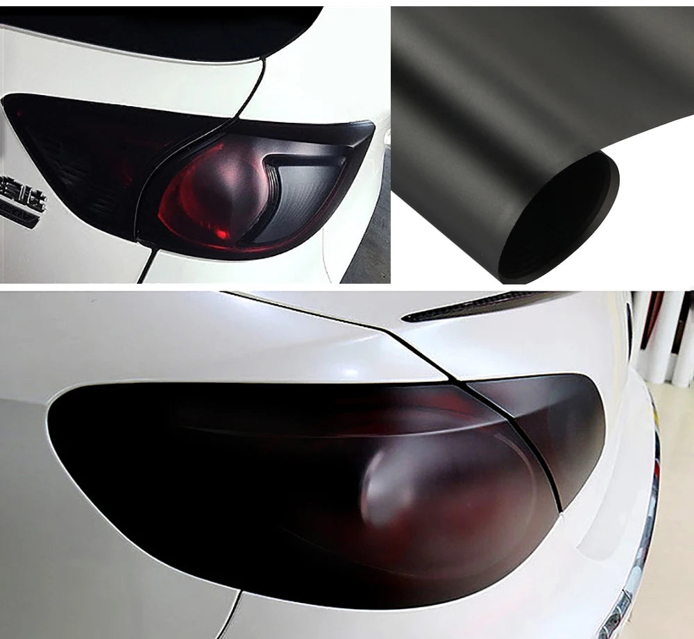 Close-up view of a matte smoke vinyl wrap film applied to a car's headlight and taillight assembly.