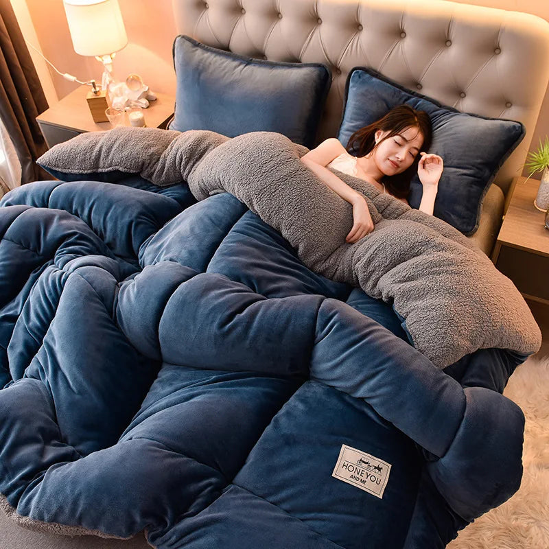A woman is relaxing under a cozy double-sided velvet warm quilt blanket in a bedroom setting.