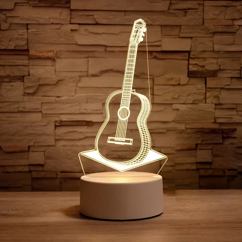 A glowing outline of an acoustic guitar is displayed on a round LED night light base.