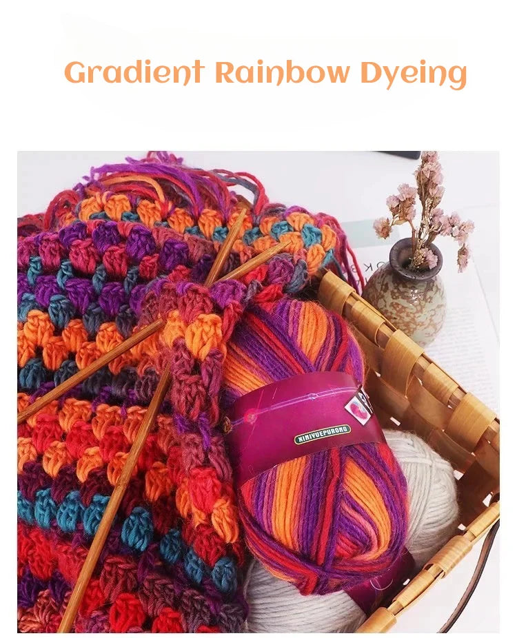 A close-up of vibrant gradient rainbow dyed wool yarn skeins used for knitting or crochet projects.