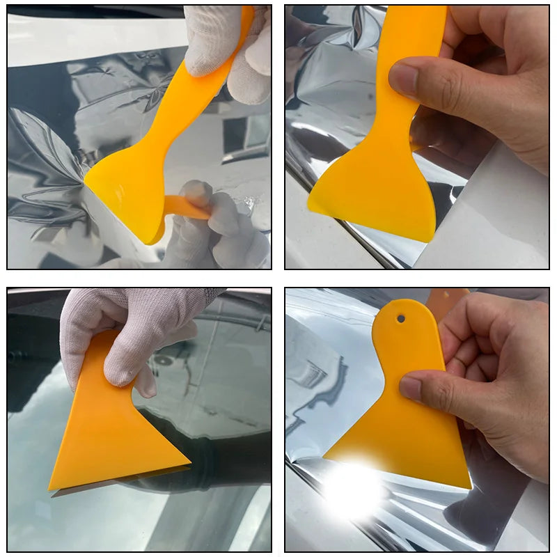 A hand is applying a yellow professional car window tint kit to the glass surface of a car window.