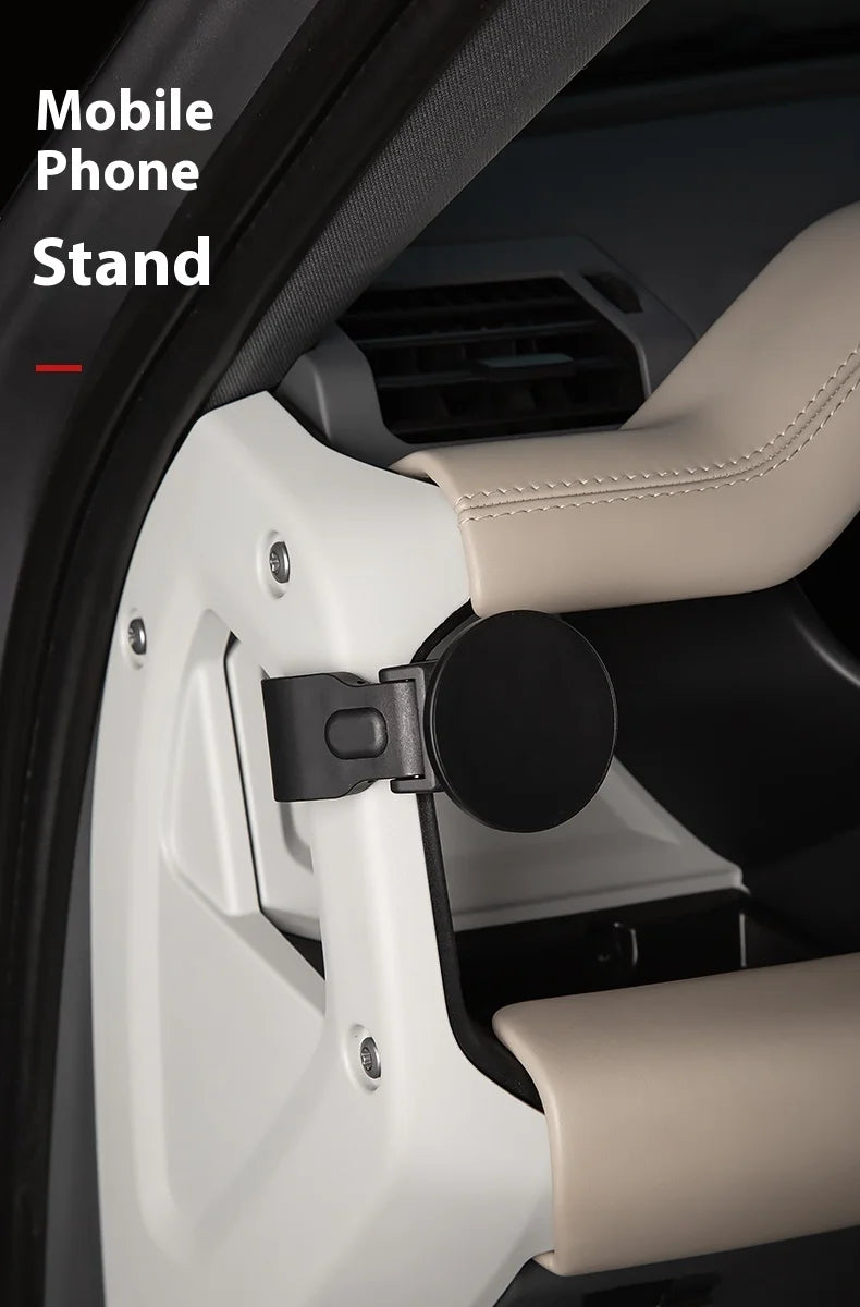 A mobile phone stand is shown mounted in a car interior, featuring a magnetic base and cup holder design.