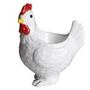 A white ceramic chicken egg cup with a red comb and yellow beak.