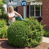 A woman is using a 2-in-1 rechargeable cordless grass shear and shrub trimmer on a dense green bush.