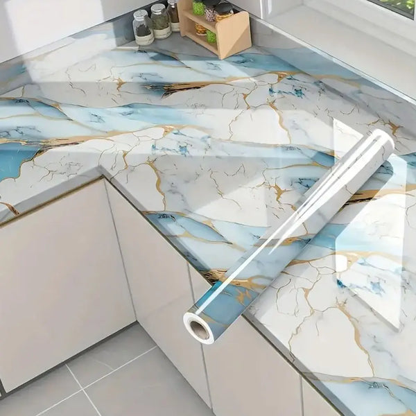 Marble contact paper featuring blue and gold veining used as a kitchen or bathroom surface design