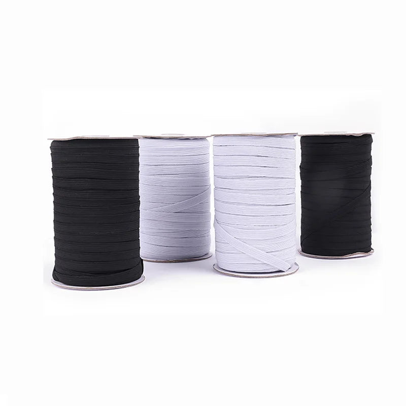 Rolls of black and white polyester elastic bands for sewing and crafts