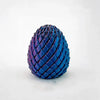 A close-up of a deep blue, textured fidget egg stress relief toy.