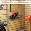 A red chainsaw is shown mounted on a wall hanger, demonstrating multiple ways to hold the saw.