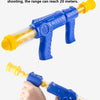A blue air-powered dart gun is shown firing a yellow dart, demonstrating a 20-meter range.