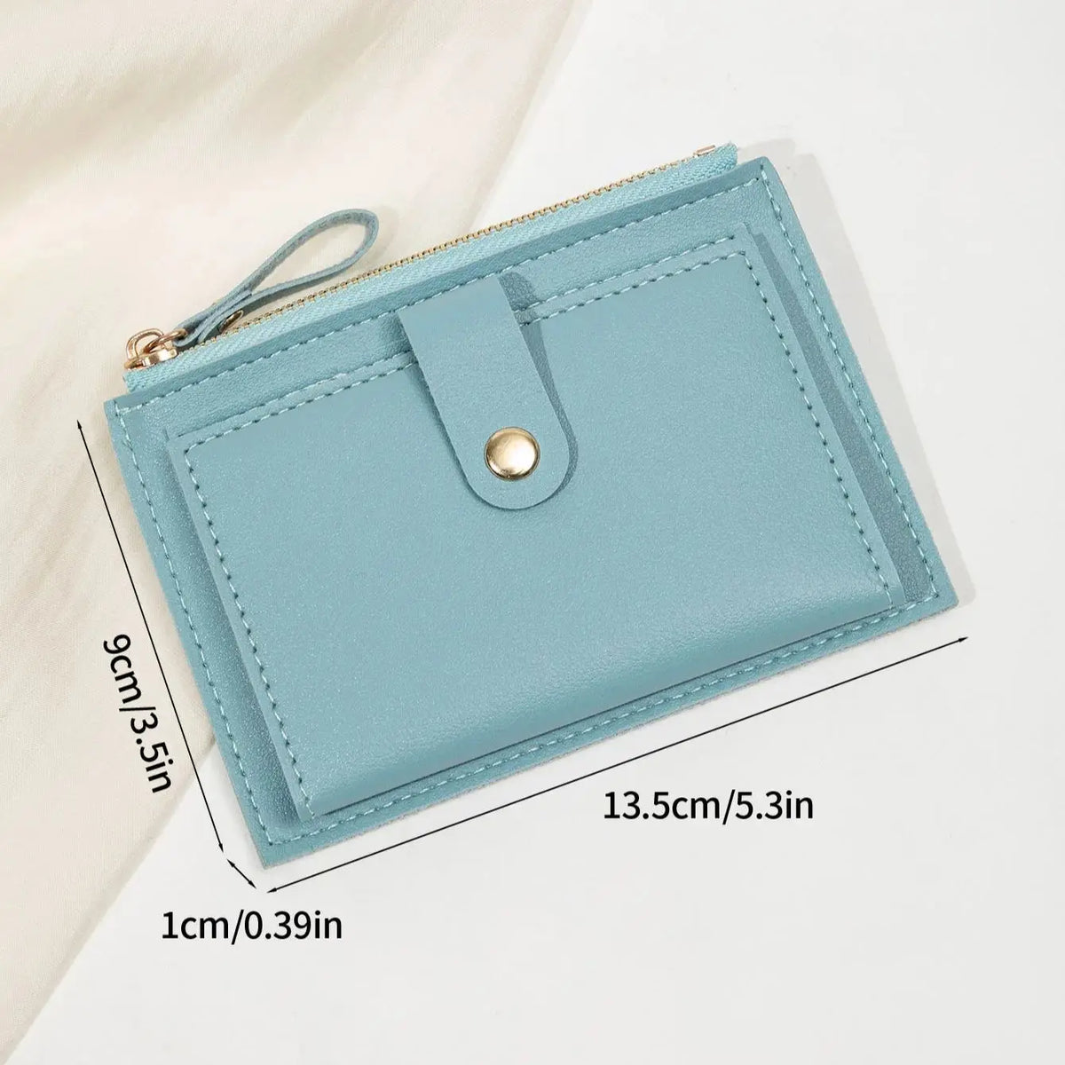 A light blue slim PU leather card holder wallet with a zipper closure and a leather flap.