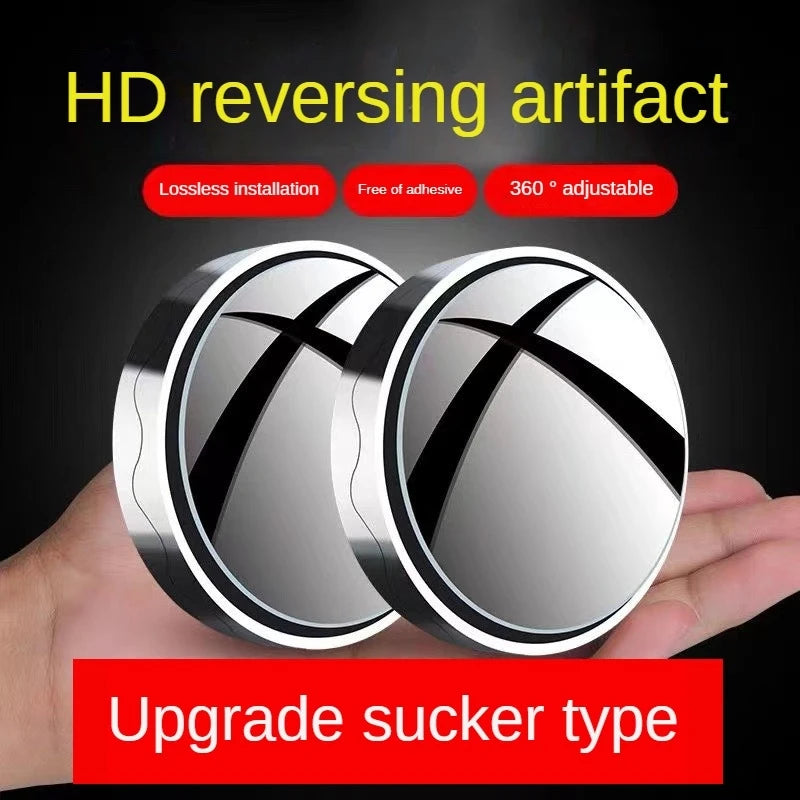A hand holds a round, silver-rimmed mirror with an X-shaped design, demonstrating an HD reversing artifact.