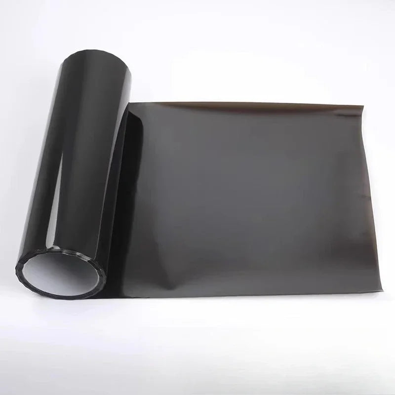 Roll of smoke black headlight and taillight tint film rolled up