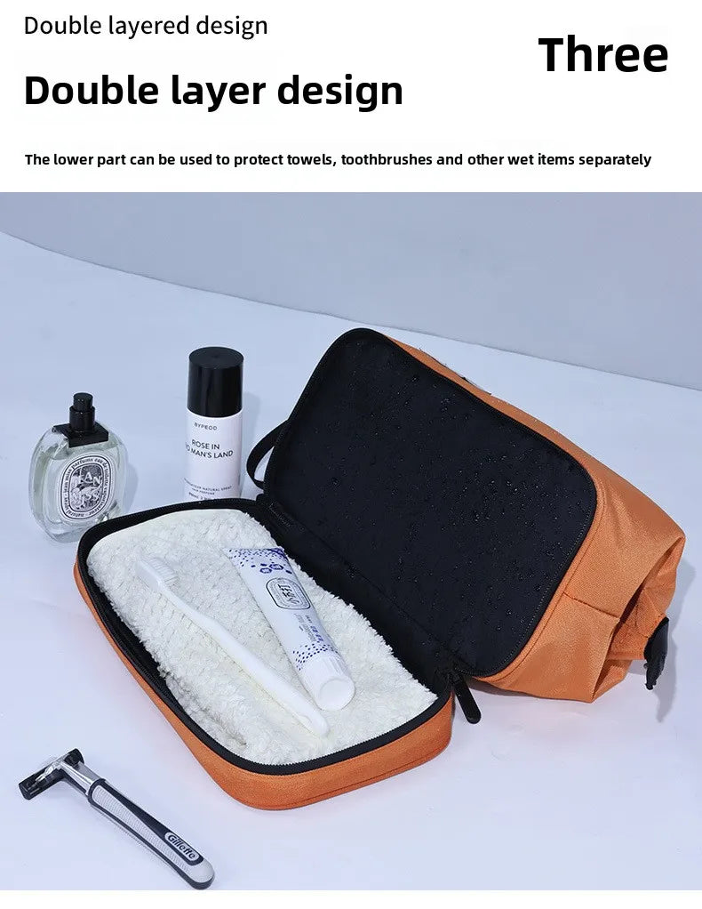 An open orange toiletry bag showing a layered design with compartments for separate storage of wet and dry items.