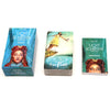 A set of three decks of the Light and Shadow Tarot deck with guidebook, featuring cover art of a woman.