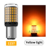 A silver LED bulb with a yellow light emitting from the translucent casing.