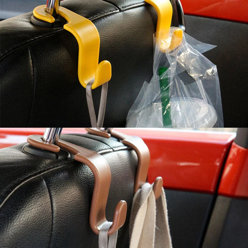 Two sets of yellow and brown headrest hooks for a car seat, shown in close-up against a red interior background.